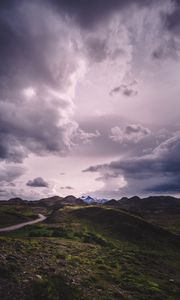 Preview wallpaper mountains, grass, clouds, overcast, twilight, cloudy