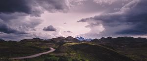 Preview wallpaper mountains, grass, clouds, overcast, twilight, cloudy