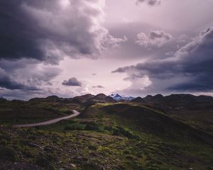 Preview wallpaper mountains, grass, clouds, overcast, twilight, cloudy