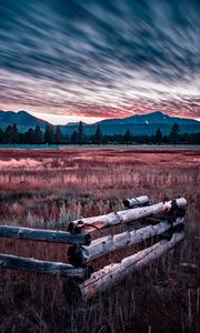 Preview wallpaper mountains, grass, fence, trees, sky, evening