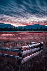Preview wallpaper mountains, grass, fence, trees, sky, evening