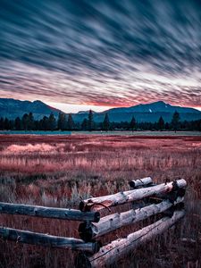 Preview wallpaper mountains, grass, fence, trees, sky, evening