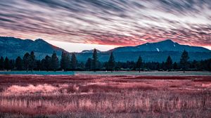 Preview wallpaper mountains, grass, fence, trees, sky, evening