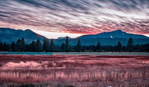 Preview wallpaper mountains, grass, fence, trees, sky, evening