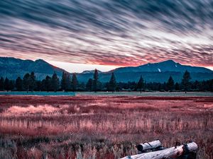 Preview wallpaper mountains, grass, fence, trees, sky, evening