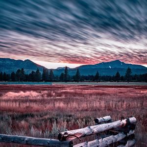 Preview wallpaper mountains, grass, fence, trees, sky, evening