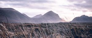 Preview wallpaper mountains, grass, landscape, clouds, fog, hilly