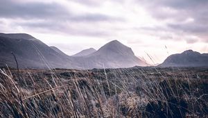 Preview wallpaper mountains, grass, landscape, clouds, fog, hilly