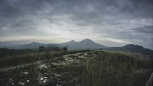 Preview wallpaper mountains, grass, path, distance