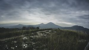 Preview wallpaper mountains, grass, path, distance