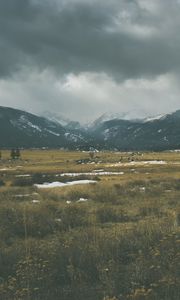 Preview wallpaper mountains, grass, sky, overcast, clouds