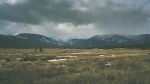 Preview wallpaper mountains, grass, sky, overcast, clouds