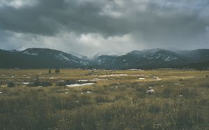 Preview wallpaper mountains, grass, sky, overcast, clouds