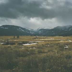 Preview wallpaper mountains, grass, sky, overcast, clouds