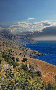 Preview wallpaper mountains, grass, sky, sea, beautifully