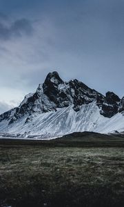 Preview wallpaper mountains, grass, snow, evening
