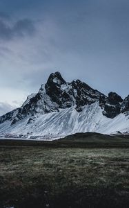 Preview wallpaper mountains, grass, snow, evening