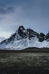 Preview wallpaper mountains, grass, snow, evening