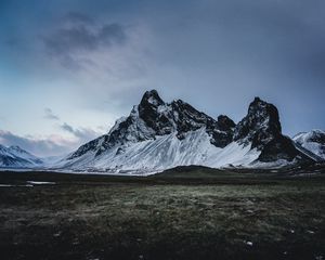 Preview wallpaper mountains, grass, snow, evening