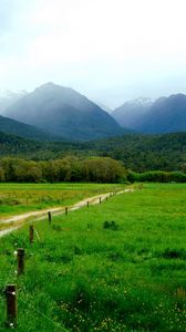 Preview wallpaper mountains, grass, summer, fence