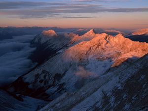 Preview wallpaper mountains, greatness, height, tops, over clouds, morning, dawn, shadow