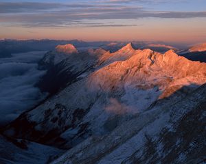 Preview wallpaper mountains, greatness, height, tops, over clouds, morning, dawn, shadow