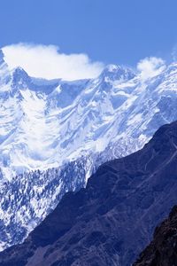 Preview wallpaper mountains, greatness, wall, snow, tops, shadow, clouds, sky