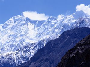 Preview wallpaper mountains, greatness, wall, snow, tops, shadow, clouds, sky