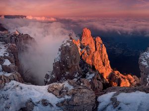 Preview wallpaper mountains, height, cross, clouds, snow, monument, memorial, grave, city, light