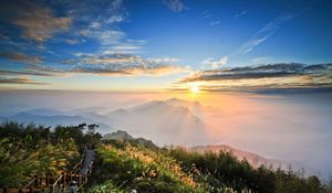 Preview wallpaper mountains, height, look, sun, light, clouds, path, tourists