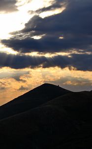 Preview wallpaper mountains, hills, clouds, rays, sun, dark