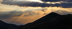 Preview wallpaper mountains, hills, clouds, rays, sun, dark