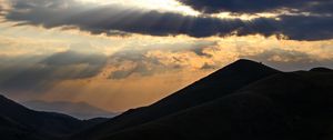 Preview wallpaper mountains, hills, clouds, rays, sun, dark
