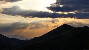 Preview wallpaper mountains, hills, clouds, rays, sun, dark