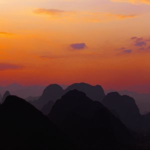 Preview wallpaper mountains, hills, distance, sunset, sky