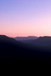 Preview wallpaper mountains, hills, distance, sunset, silhouette, sky