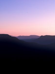 Preview wallpaper mountains, hills, distance, sunset, silhouette, sky