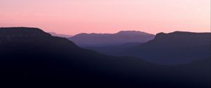 Preview wallpaper mountains, hills, distance, sunset, silhouette, sky