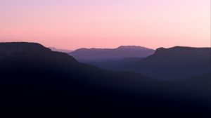 Preview wallpaper mountains, hills, distance, sunset, silhouette, sky
