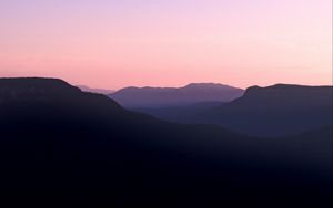 Preview wallpaper mountains, hills, distance, sunset, silhouette, sky