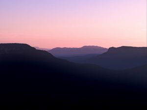 Preview wallpaper mountains, hills, distance, sunset, silhouette, sky