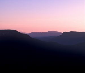 Preview wallpaper mountains, hills, distance, sunset, silhouette, sky