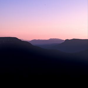 Preview wallpaper mountains, hills, distance, sunset, silhouette, sky