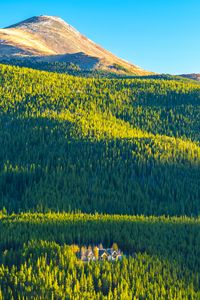 Preview wallpaper mountains, hills, forest, trees, houses, landscape, aerial view