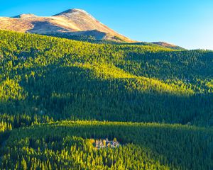 Preview wallpaper mountains, hills, forest, trees, houses, landscape, aerial view