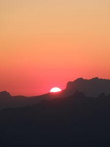 Preview wallpaper mountains, hills, silhouettes, sunset, sun, dark