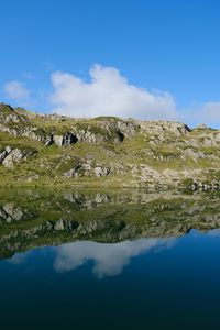 Preview wallpaper mountains, hills, stones, reflection, lake, landscape