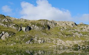 Preview wallpaper mountains, hills, stones, reflection, lake, landscape
