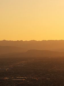 Preview wallpaper mountains, hills, town, sunrise