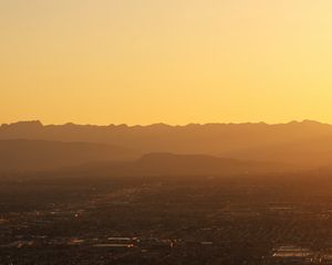 Preview wallpaper mountains, hills, town, sunrise